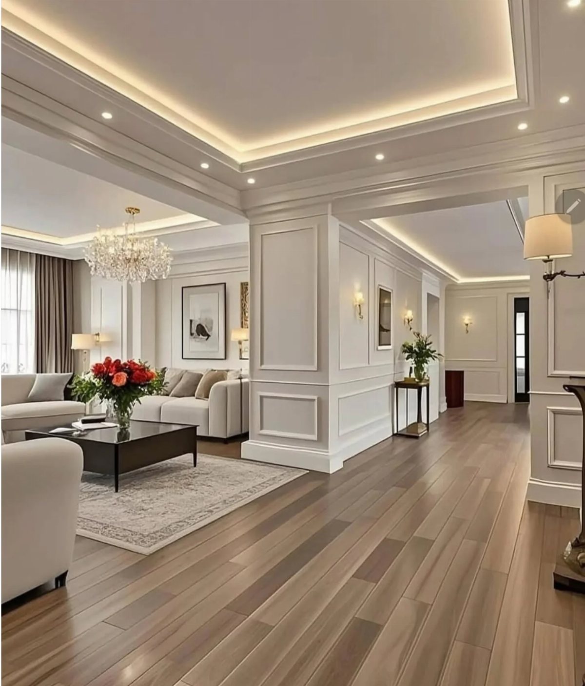 White wainscoting panels on walls in a modern living room with wooden floors and a chandelier.